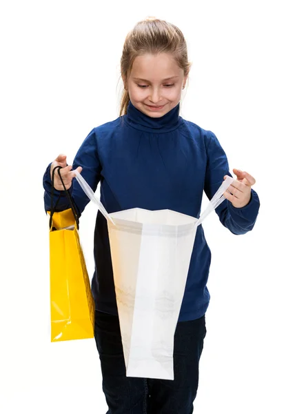 Pretty small girl with shopping bags — Stock Photo, Image