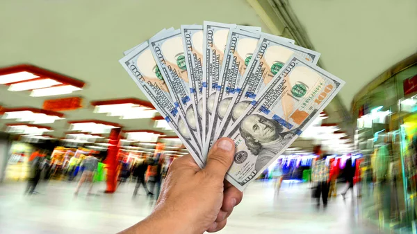 Man holding stack of dollar bills — Stock Photo, Image