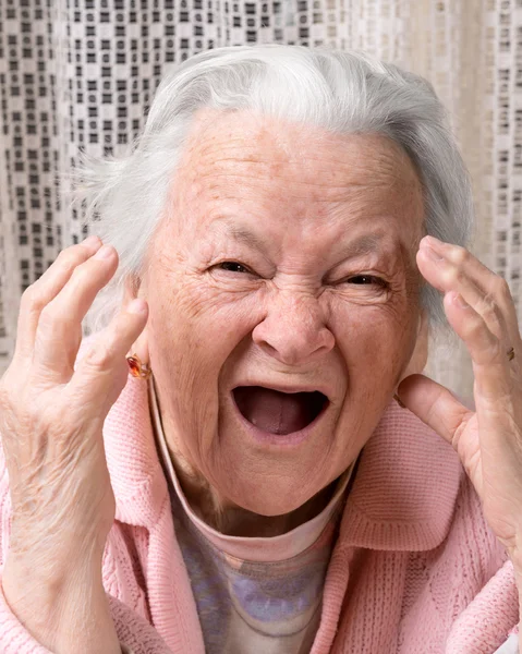 Closeup portrait of scared old woman — Stock Photo, Image