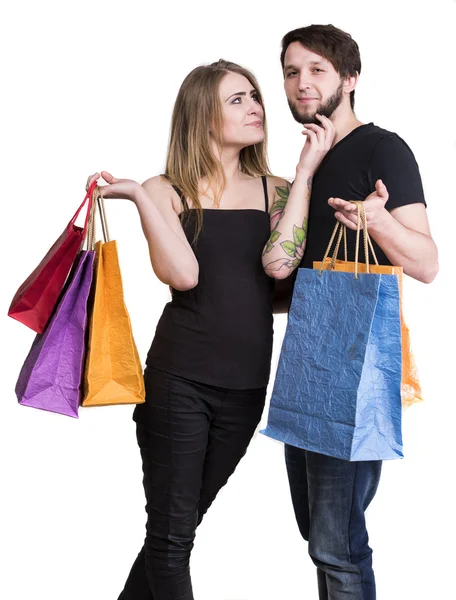 Glückliches Paar mit Einkaufstaschen — Stockfoto