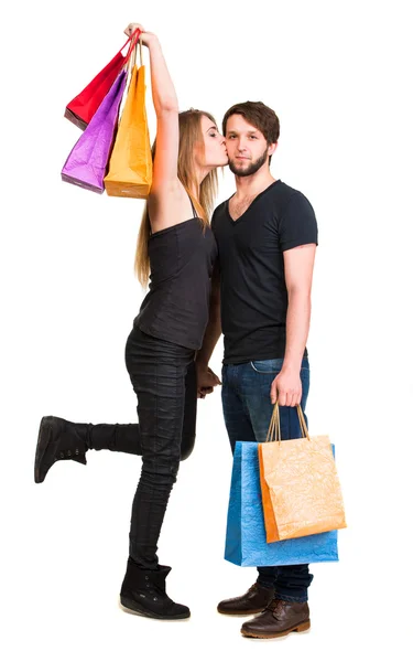 Casal feliz com sacos de compras — Fotografia de Stock