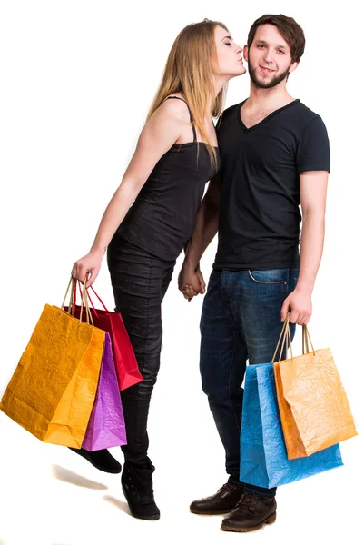 Feliz pareja con bolsas de compras —  Fotos de Stock