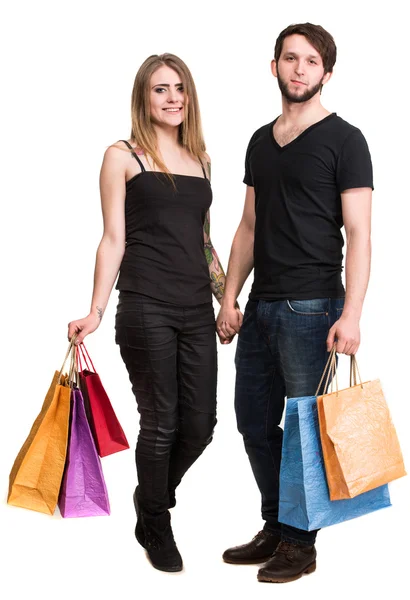 Feliz pareja con bolsas de compras —  Fotos de Stock