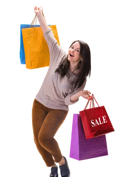 Jovem mulher feliz com sacos de compras — Fotografia de Stock