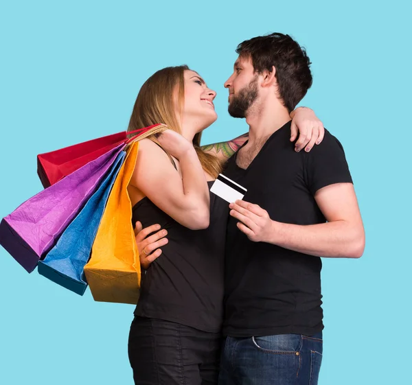 Feliz pareja con bolsas de compras —  Fotos de Stock