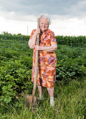 Old woman with a shovel 