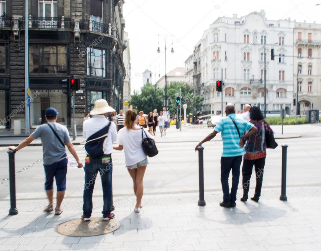 People waiting for green traffic light