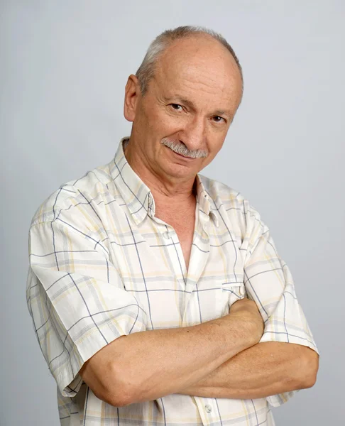 Portrait of smiling senior man — Stock Photo, Image