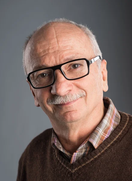 Portrait of a senior smiling man — Stock Photo, Image