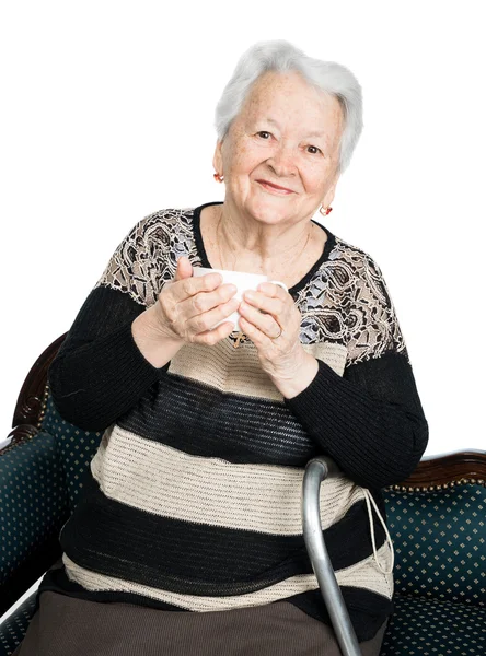 Old woman enjoying coffee or tea cup — Stock Photo, Image