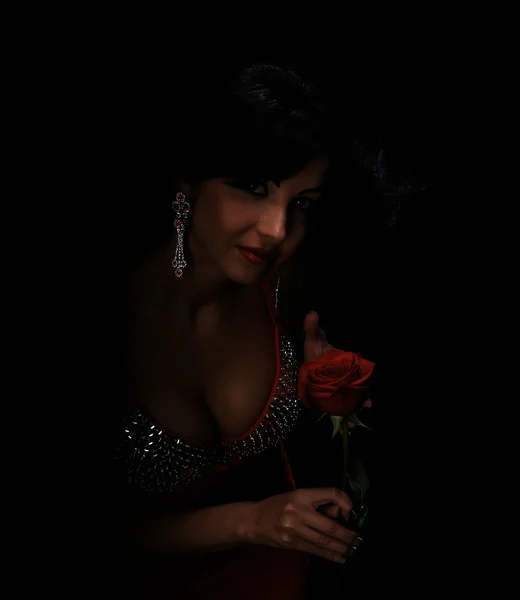 Beautiful young woman with red rose — Stock Photo, Image