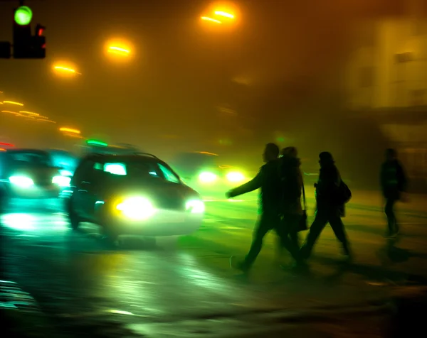 Busy city street people on zebra crossing at night — Stock Photo, Image