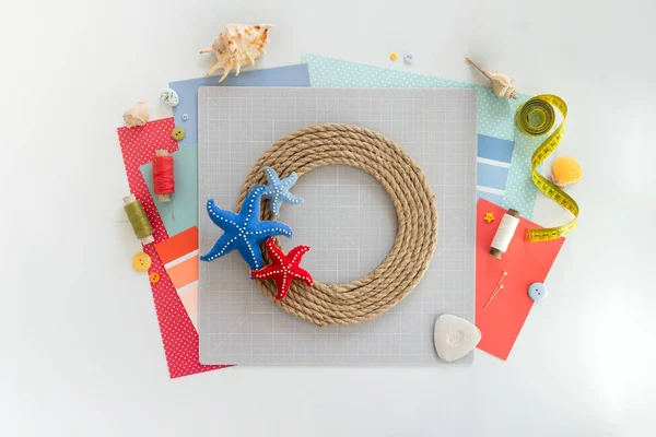 DIY instruction. Step by step tutorial. Making Summer decor - wreath of rope with sea stars made of felt. Craft tools and supplies. Step 7 - Final