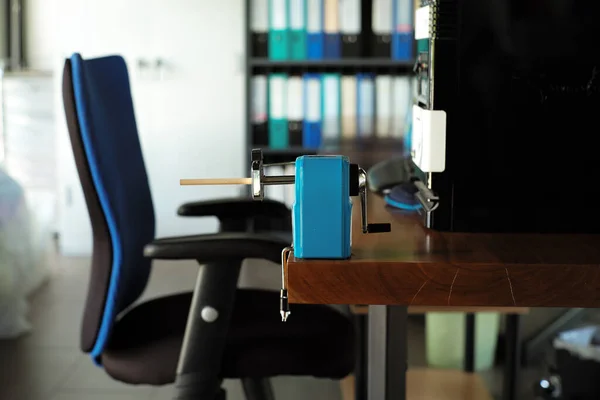 Closeup Pencil Sharpener Pencil Installed Top Wooden Table Blurred Computer — Stock Photo, Image