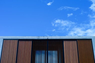 Closeup facade and cencrete building with clear sky background