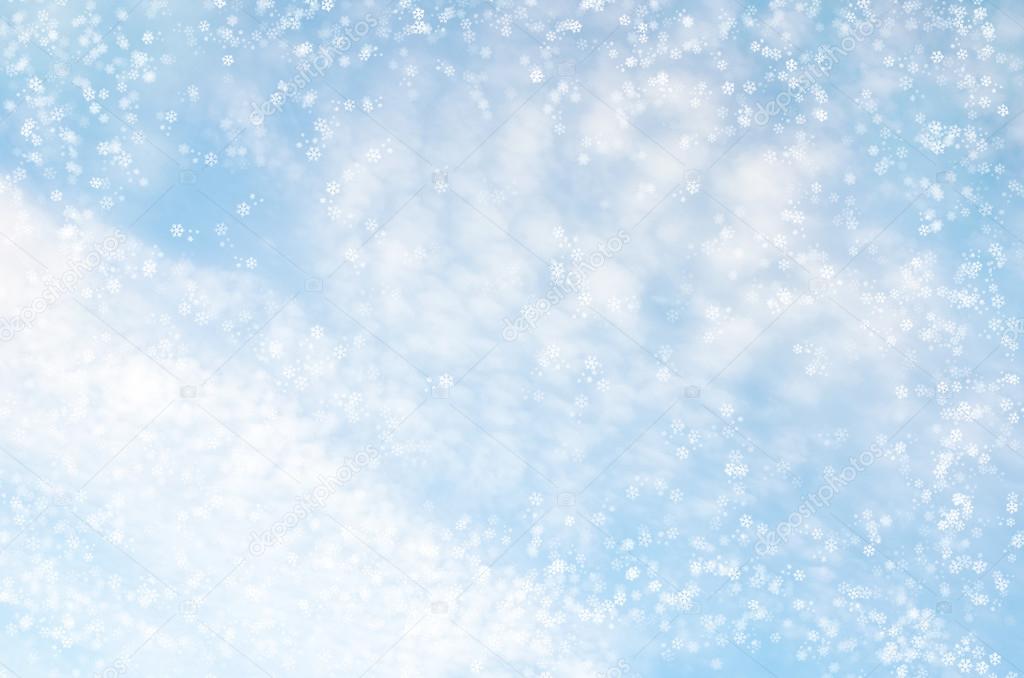 Falling snowflakes on  blue background