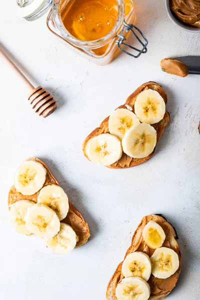 sweet sandwiches for breakfast with banana and pasta and honey top view