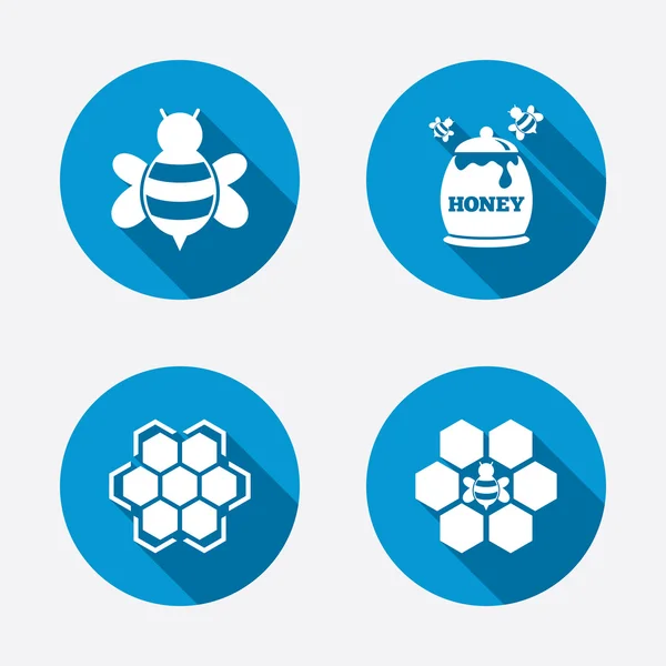 Cellules en nid d'abeilles avec symboles d'abeilles — Image vectorielle