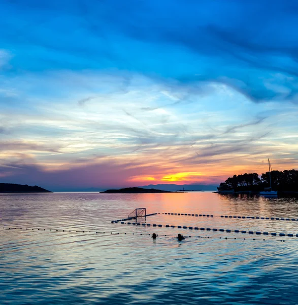 Colorful sunset with water polo playfield — Stock Photo, Image