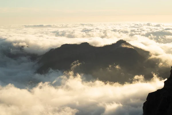 Mountains sticking out of the sea of clouds