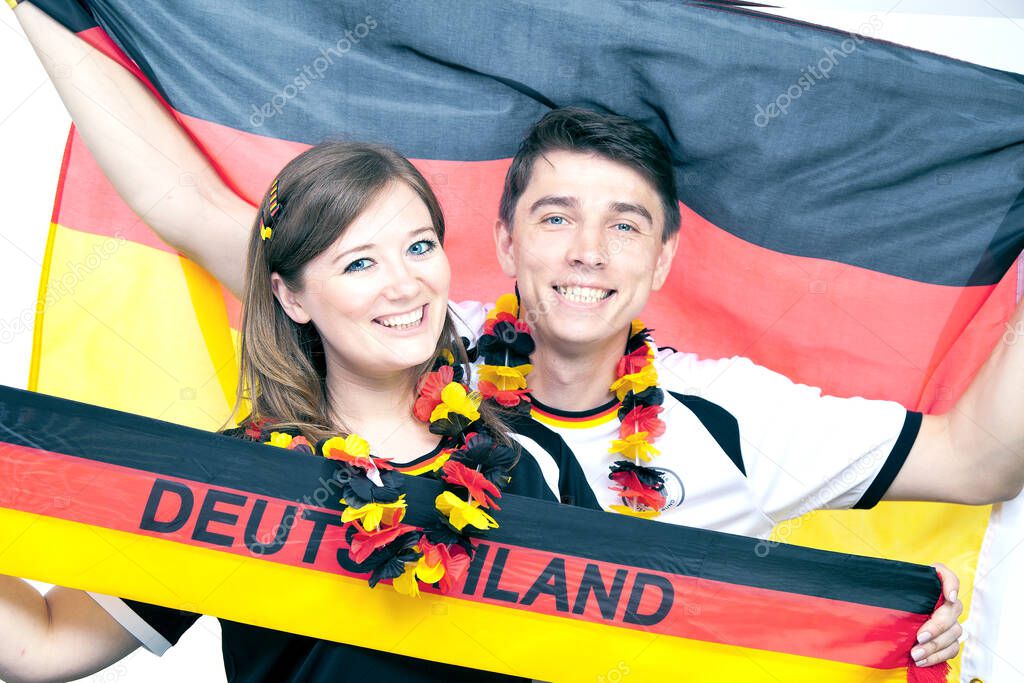 couple of enthusiastic German sport soccer fans celebrating victory. German Young Couple Supporting the Team