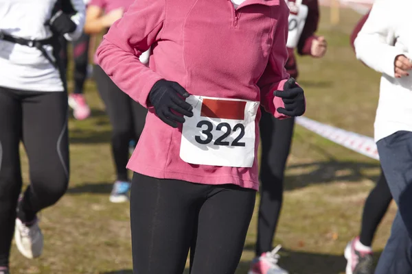 Female athletic runners on a cross country race. Outdoor circuit — Stock Photo, Image