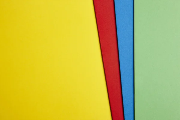 Цветной картонный фон в желтом красно-синем зеленом. Copy spa — стоковое фото