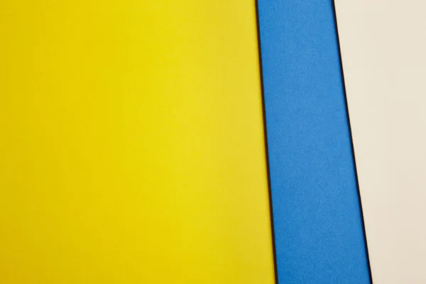 Цветной картонный фон в желтом синем бежевом тоне. Copy sp — стоковое фото