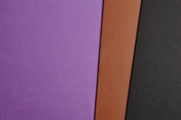 彩色的硬纸板背景在紫色棕色黑色基调。复制 s — 图库照片