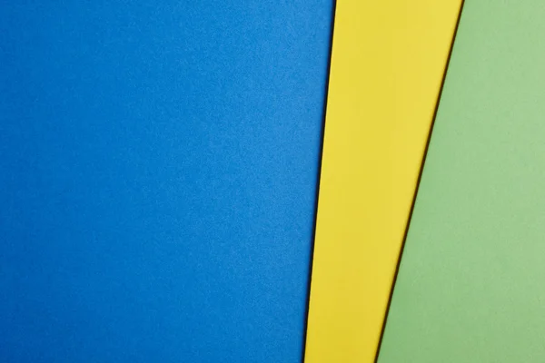彩色的硬纸板背景在蓝色黄色绿色色调。Sp 复制 — 图库照片