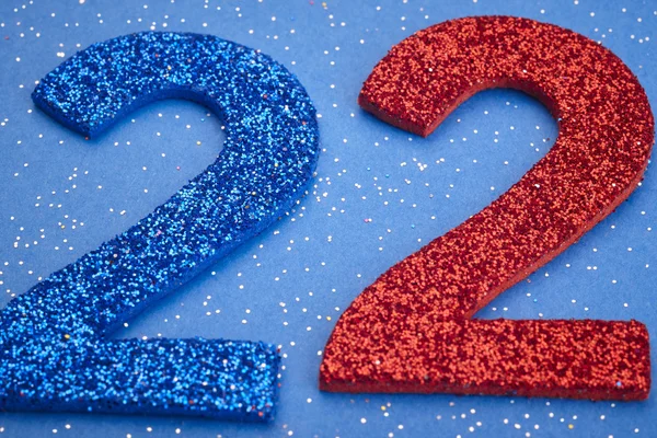 Αριθμός twentytwo μπλε κόκκινο χρώμα πάνω σε μπλε φόντο. Annivers — Φωτογραφία Αρχείου