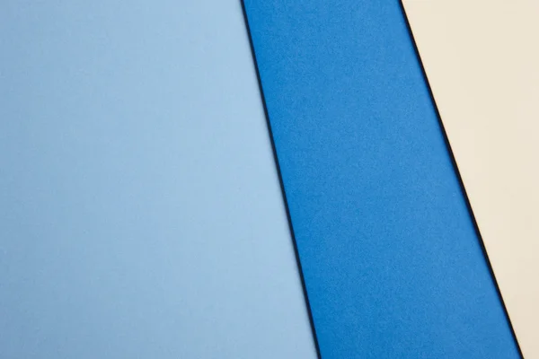 彩色的硬纸板背景在蓝色米色基调。复制空间 — 图库照片