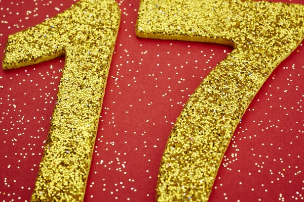 Number seventeen yellow color over a red background. Anniversary — Stock Photo, Image