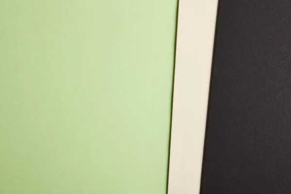 彩色的硬纸板背景在绿色米色黑色基调。Sp 复制 — 图库照片