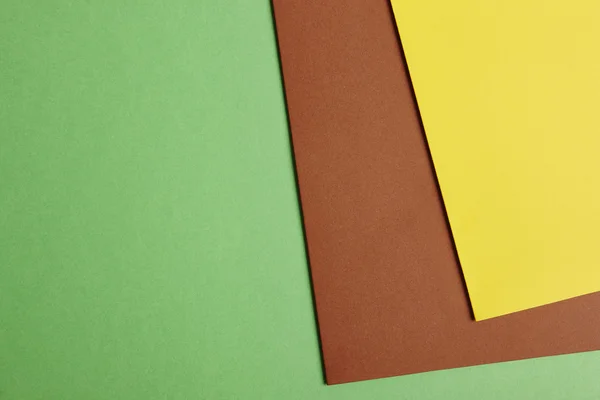 彩色的硬纸板背景在绿色棕色黄色调。复制 s — 图库照片
