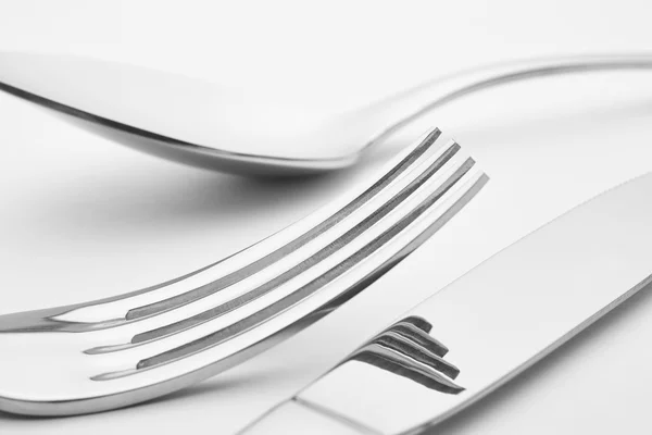 Knife fork spoon detail over a white background. Cutlery. — Stock Photo, Image