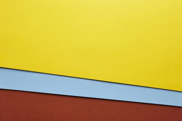 Färgade pappna bakgrund i gul blå brun ton. Kopiera sp — Stockfoto