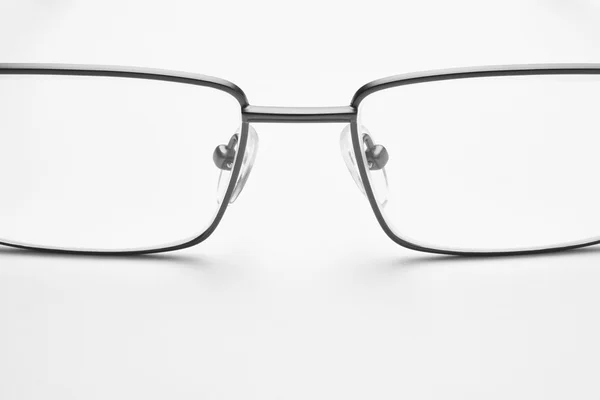 Male eyeglasses macro detail over a white background — Stock Photo, Image