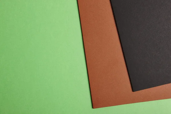 彩色的硬纸板背景在绿色棕色黑色基调。Sp 复制 — 图库照片
