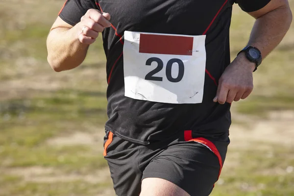 Male athletic runner on a cross country race. Outdoor circuit — Stock Photo, Image