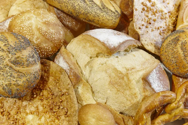 Different kinds of bread on a basket. Bakery. — Stock Photo, Image