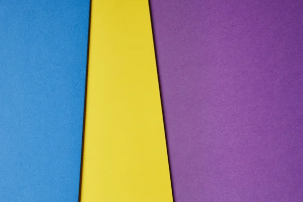 彩色的硬纸板背景在蓝色黄色紫色色调。复制 s — 图库照片