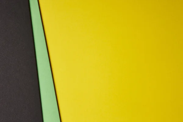 彩色的硬纸板背景黑色绿色黄色基调。复制 s — 图库照片