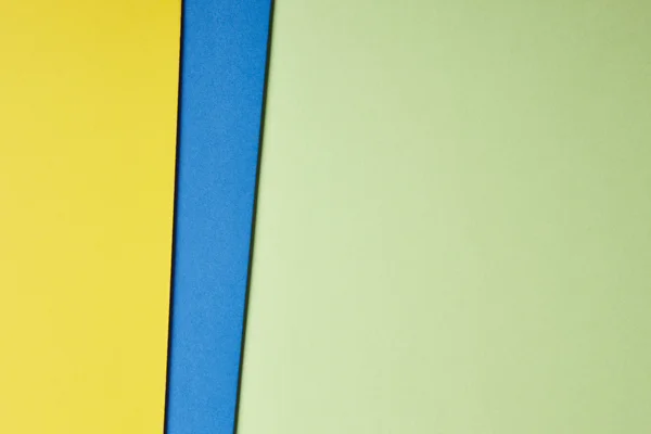 Colored cardboards background yellow blue green tone. Copy space — Stock Photo, Image