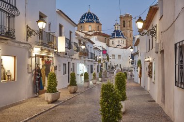 Spanish mediterranean village of Altea. Picturesque white facades by night clipart