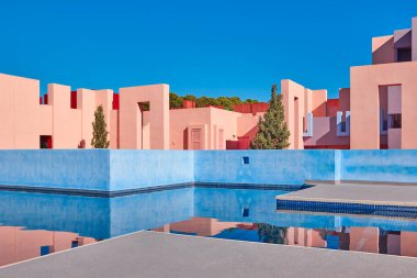 Geometric building with pool. The red wall, Calp, Spain clipart