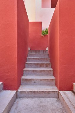 Geometric red building design. The red wall, La manzanera. Calpe, Spain clipart