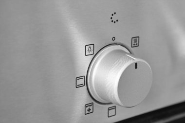 Fırın ısı kontrol düğmesi. Mutfak ekipman paneli ayrıntıları. Fırın