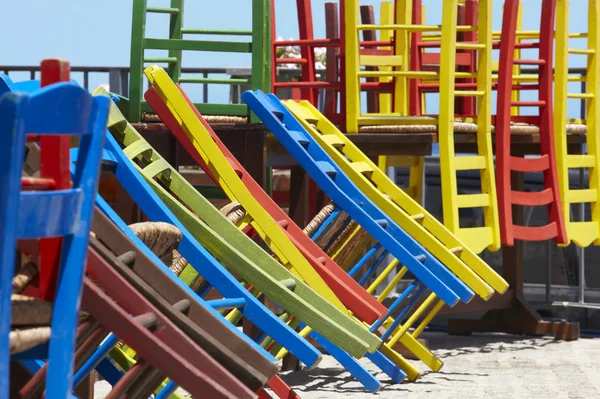 Traditional multicolored greek chairs in a taverna — Stock Photo, Image