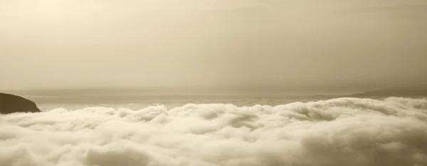 View of the sky above the clouds in sepia tone — Stock Photo, Image